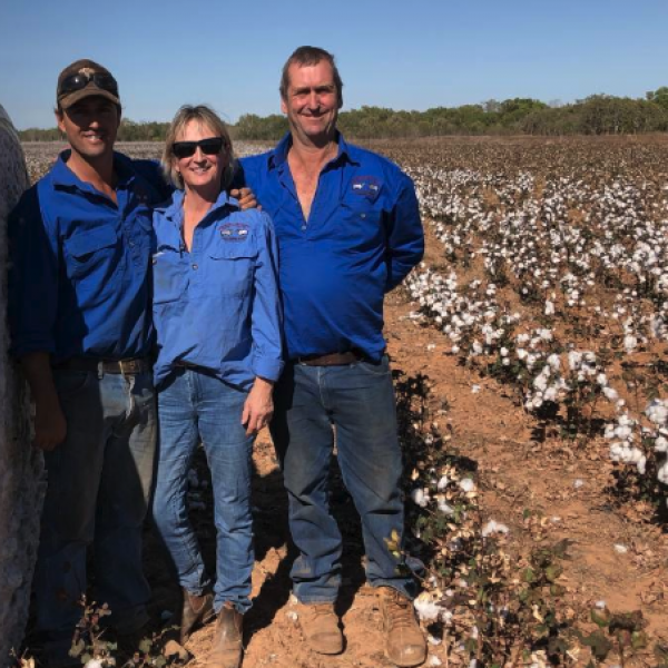 Nick Black, Maya Black and Steve Black stand with one of the many bales of cotton grown on their their station