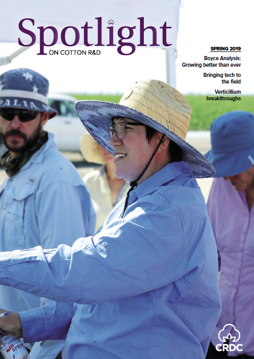 A cotton researcher at a field day speaking to growers.